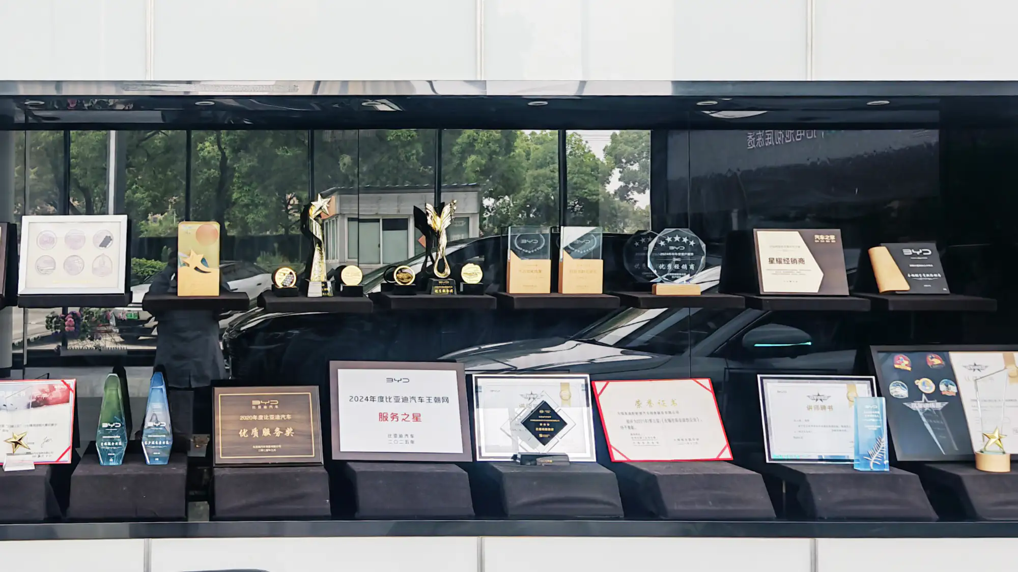SudiAuto Trophy and Award Certificates Display - Government Fleet Partner Recognition and Industry Honors